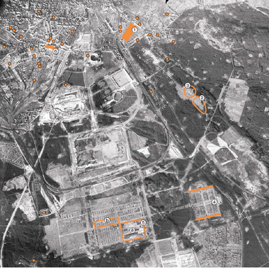 The markings show where the various forced labour camp structures were located on the former Nazi Party Rally Grounds and in the city. In the centre of the picture, the planned large-scale buildings &ndash; the Congress Hall, the Zeppelin Field and the foundation pits for the German Stadium and the M&auml;rzfeld (March Field) &ndash; are clearly visible. Aerial photograph, December 1944 &copy; Stadtarchiv N&uuml;rnberg, Dokumentationszentrum Reichsparteitagsgel&auml;nde, National Collection of Aerial Photography, US/00035/A, 7040